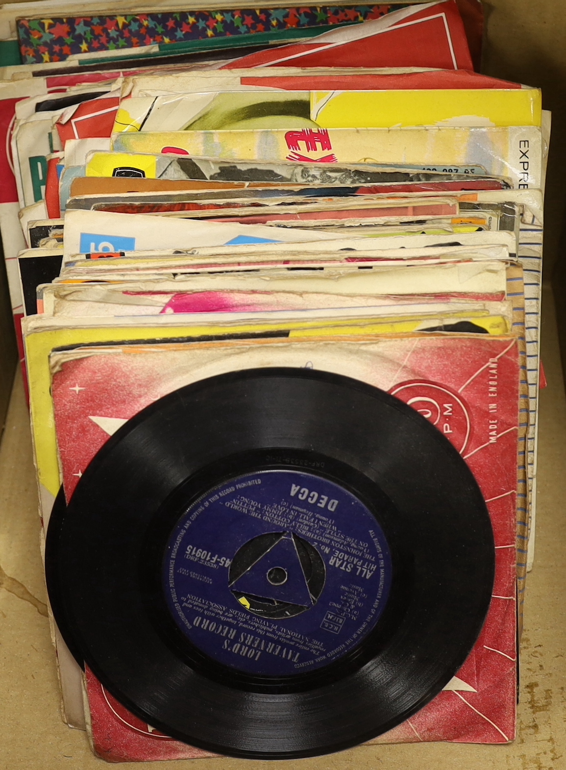 A collection of 45rpm 7 inch singles, artist include Elvis Presley, the Beatles, Creedence Clearwater Revival, T-Rex, Tom Jones, Cat Stevens, etc. (nine Beatles singles)